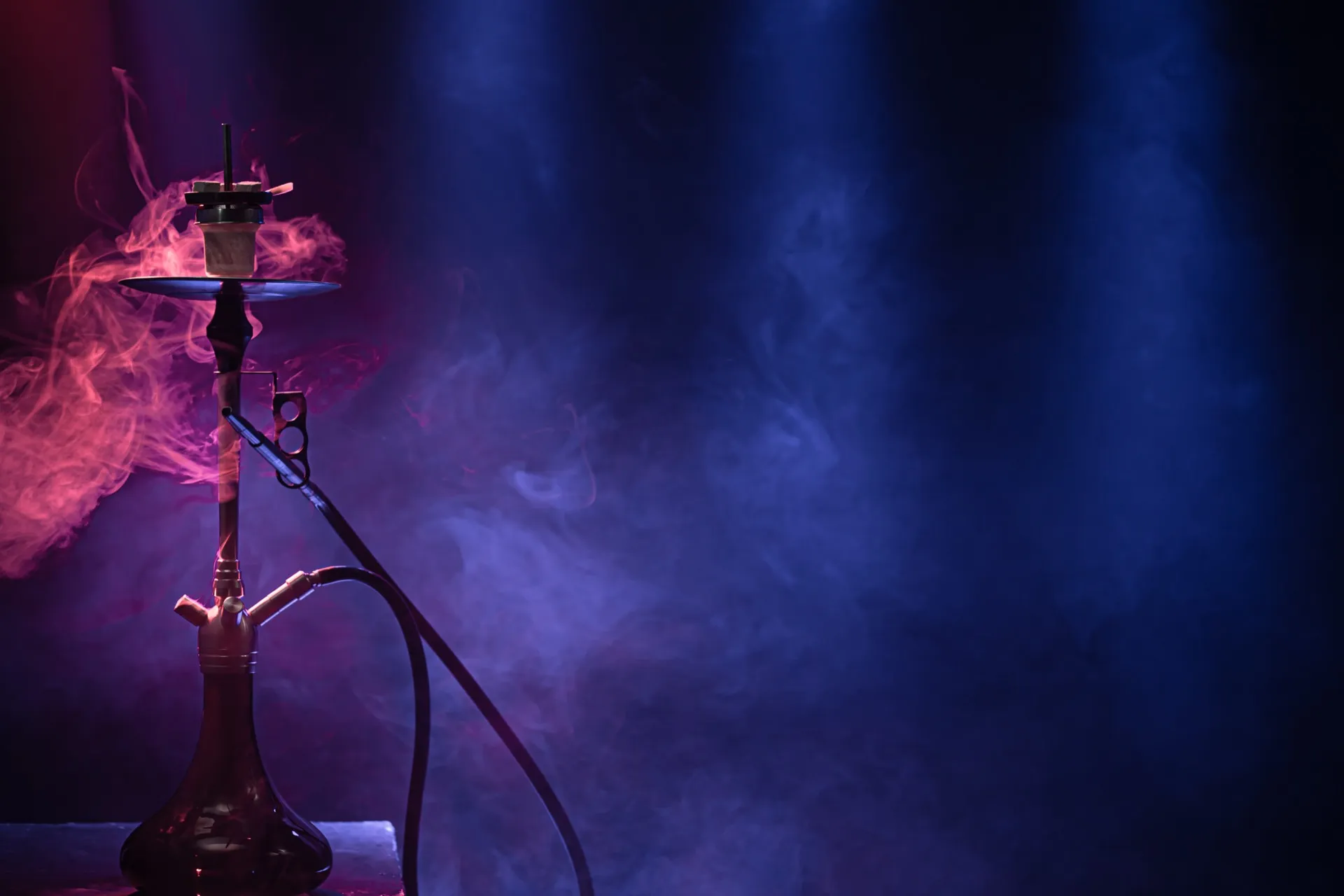 Charcoal N Chill hookah lounge interior in Alpharetta GA — premium VIP Versace seating, ambient lighting, and craft cocktails